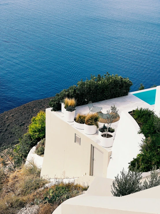 an aerial view of a swimming pool and house