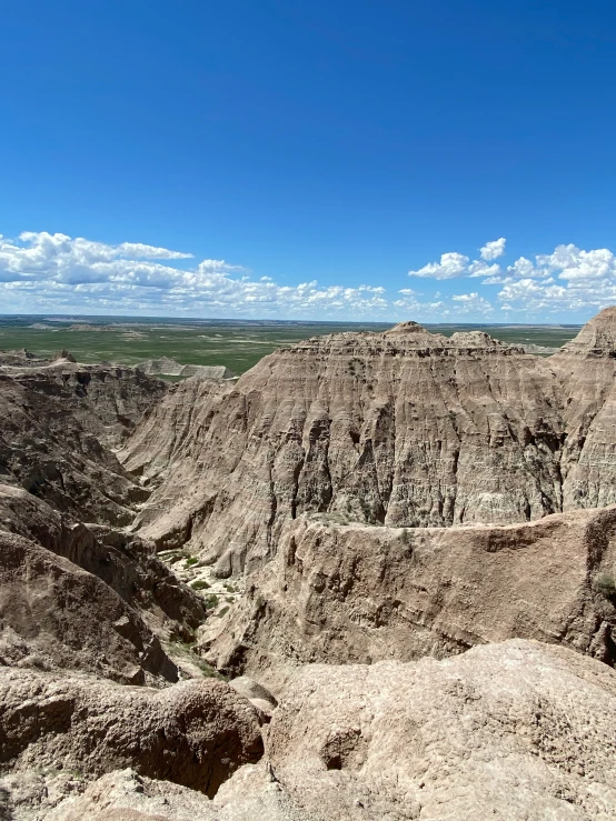 a view of a vast landscape is seen on a sunny day