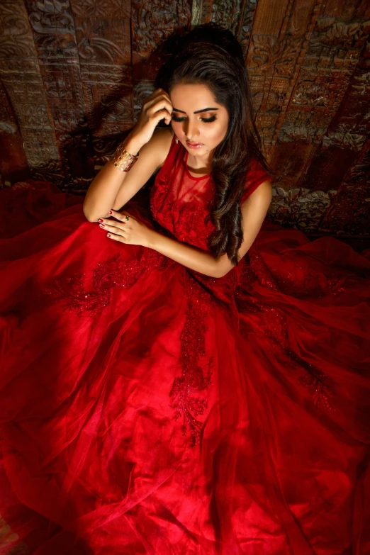 the woman is in a red dress posing for a po
