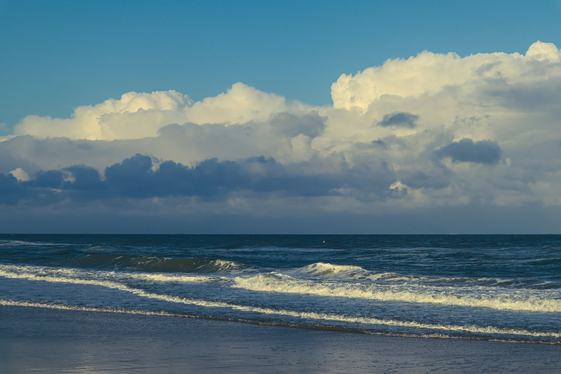 there is a surfer coming out to the water