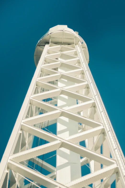 a tall metal structure with a clock on the top