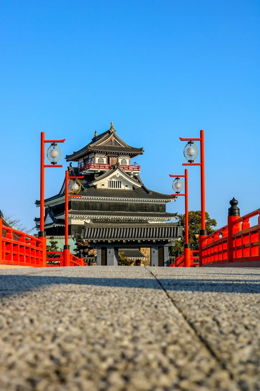 a chinese style building is near the bridge