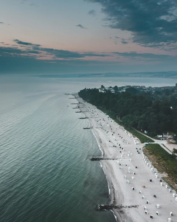 a beach that is next to some water