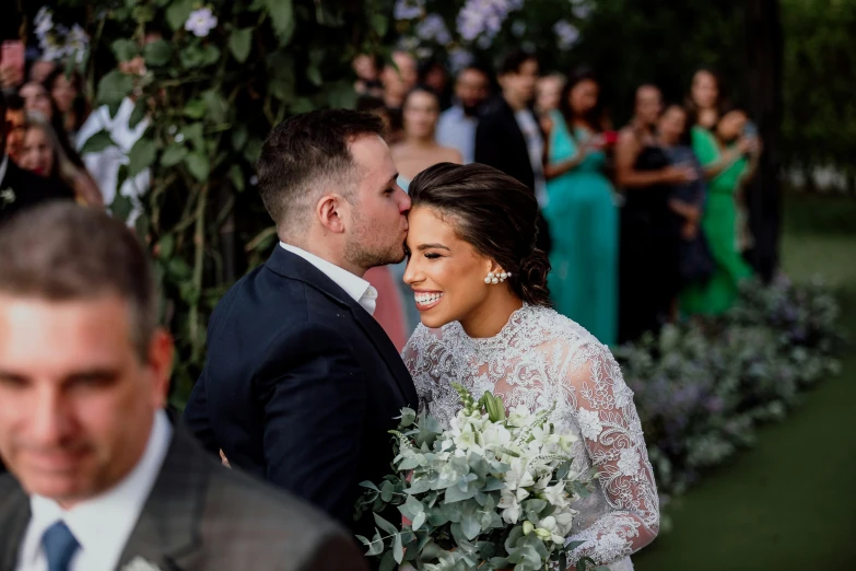 a bride and groom are at the alter