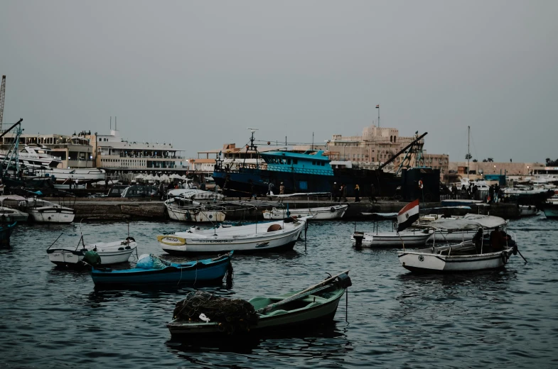 a number of small boats in a harbor