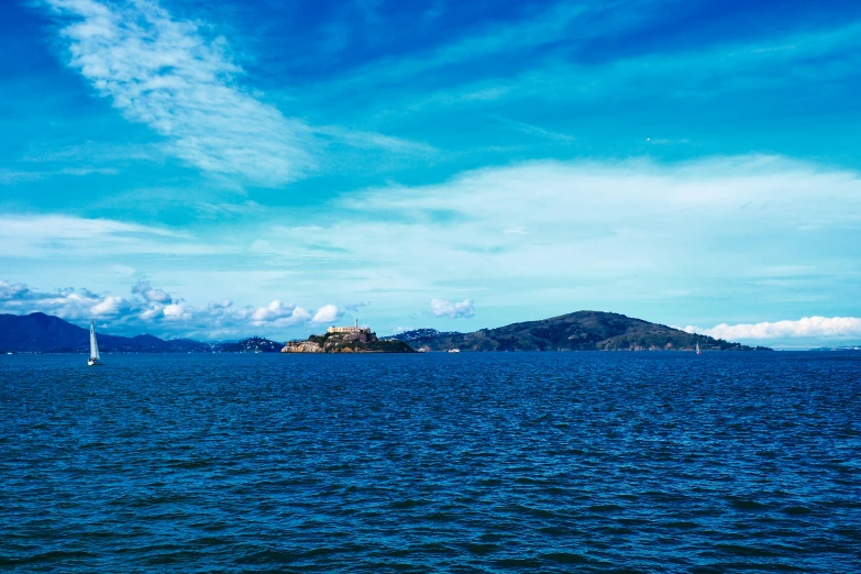 a large body of water that has a island in the distance