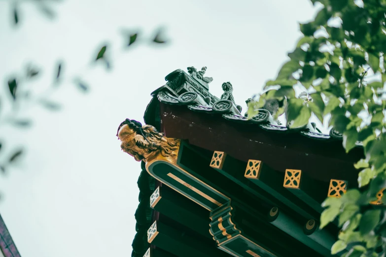 the roof of a building with a dragon decoration