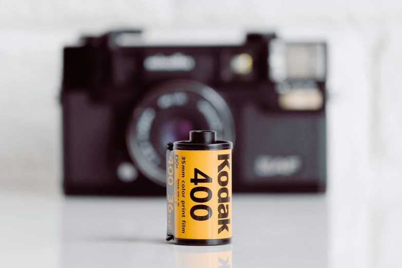 a yellow battery sits on a white counter