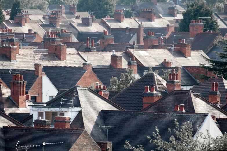 a view of a city with rows of rooftops