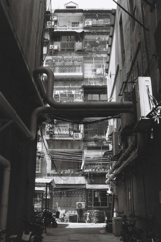 several buildings on the street behind the walkway