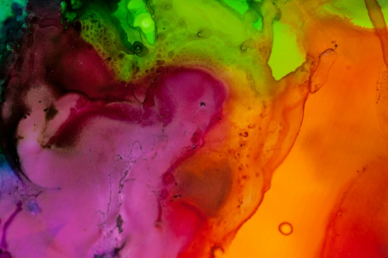 an abstract painting of colorful paint and a liquid substance