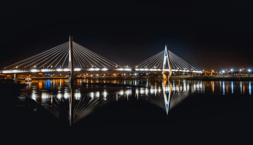 night pograph of the bridge over a body of water