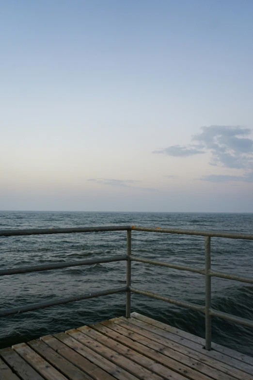 an ocean view with a pier in the foreground