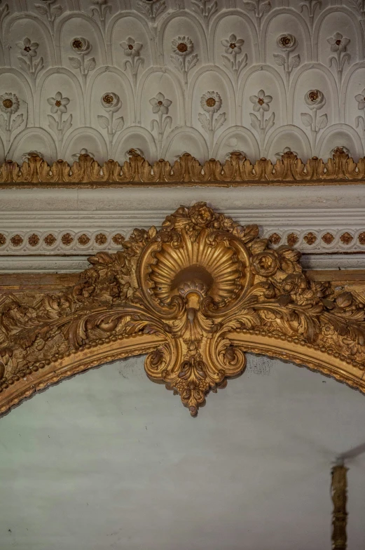 the design in the golden frame is intricate
