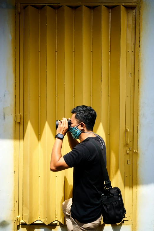 a man is taking a po with his cellphone