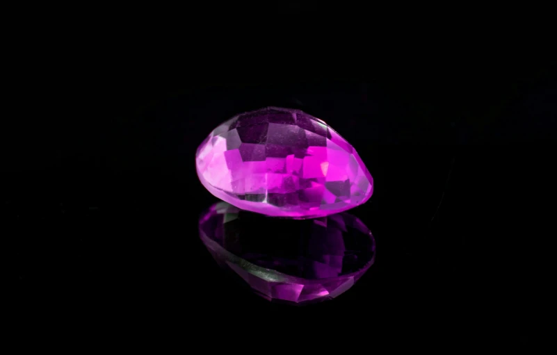 a bright purple diamond resting on a table
