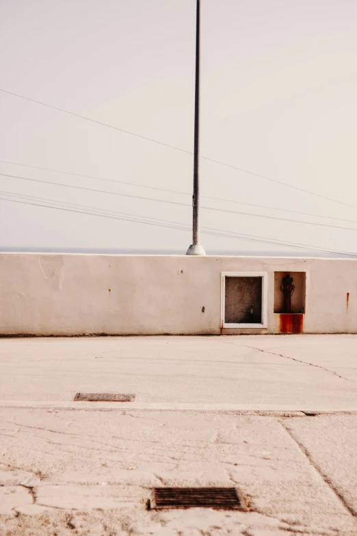 an open fire hydrant in front of a building