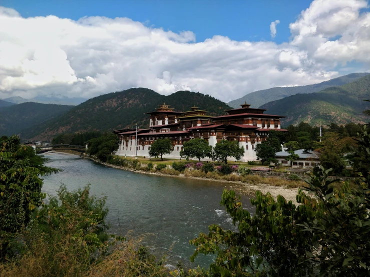 the view of a chinese structure in the mountains