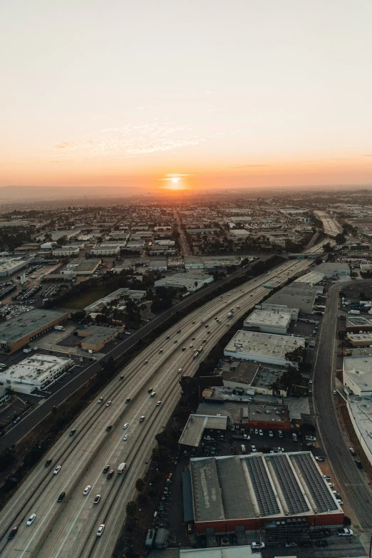 a big road surrounded by other roads at sunset