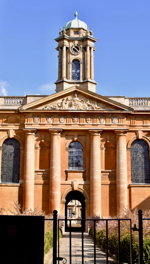 a clock tower and a church building on the side