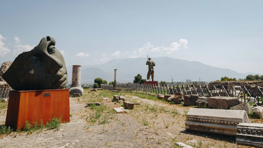 there are a lot of grave markers and statues in this graveyard