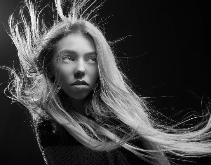 black and white pograph of a girl with long blond hair