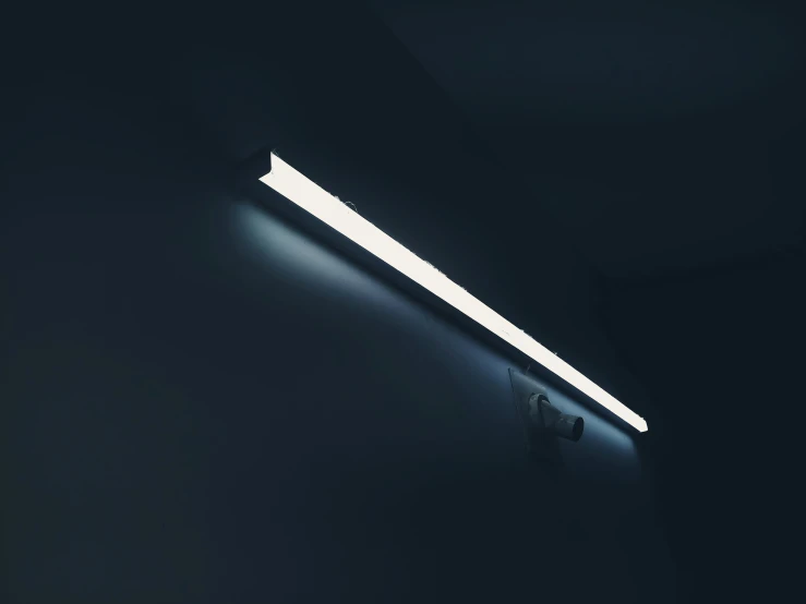 a strip light hanging on a wall