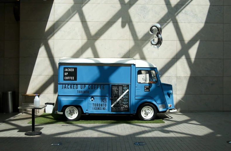 a food truck is shown parked in front of a building