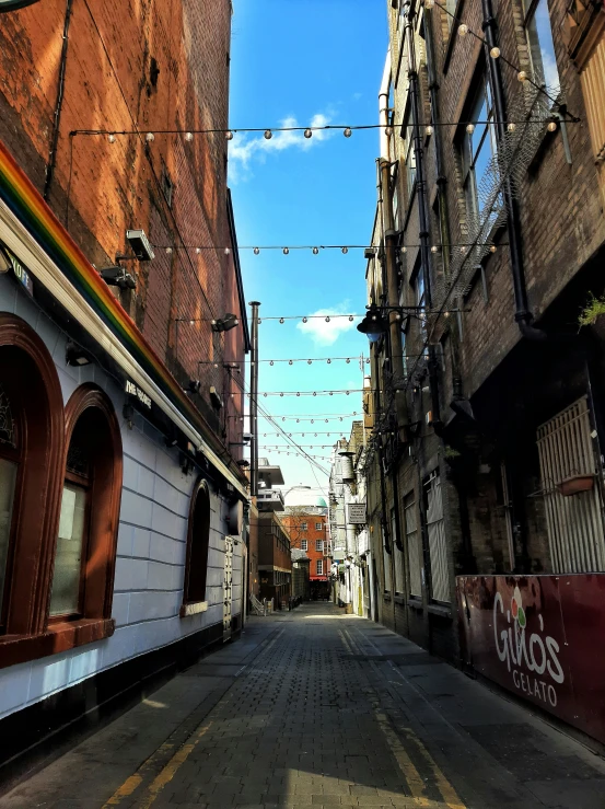 an empty street lined with buildings and a traffic signal