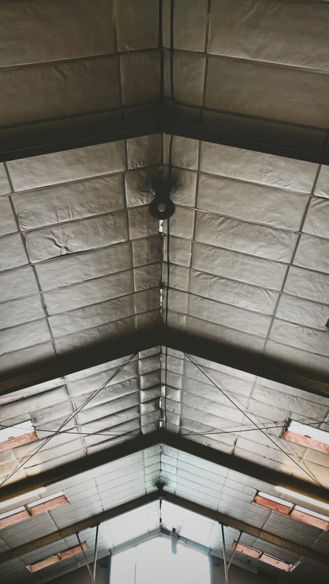 a loft of some kind with a ceiling made of concrete