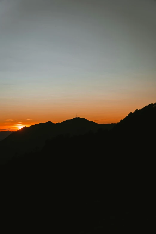 a mountain with a hill in the distance