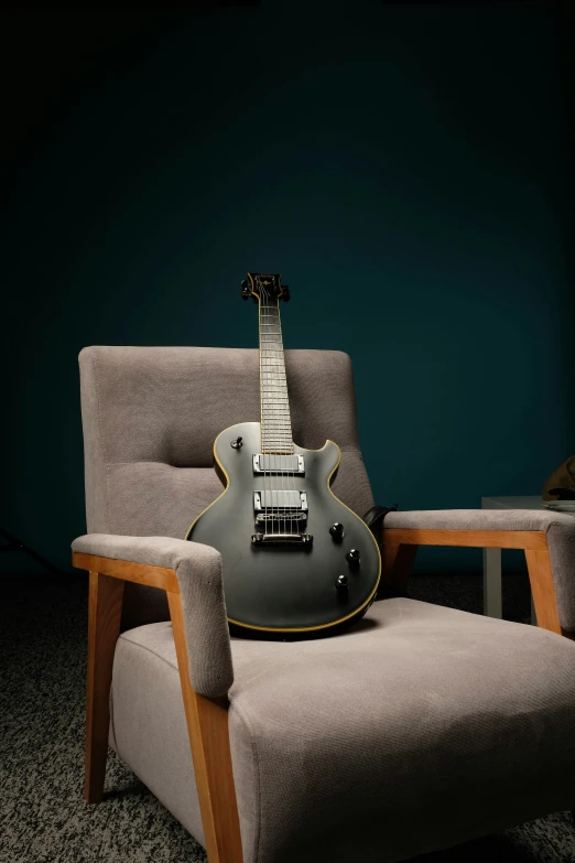 an electric guitar resting on a chair