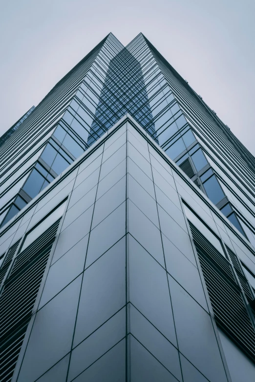 the top side of a tall glass building