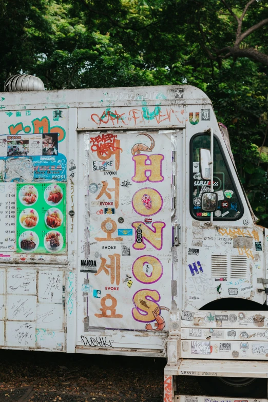 a white truck that has been decorated with many different stickers