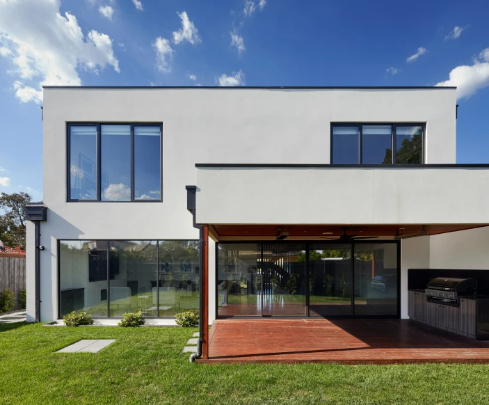 an outside room with an awning and patio