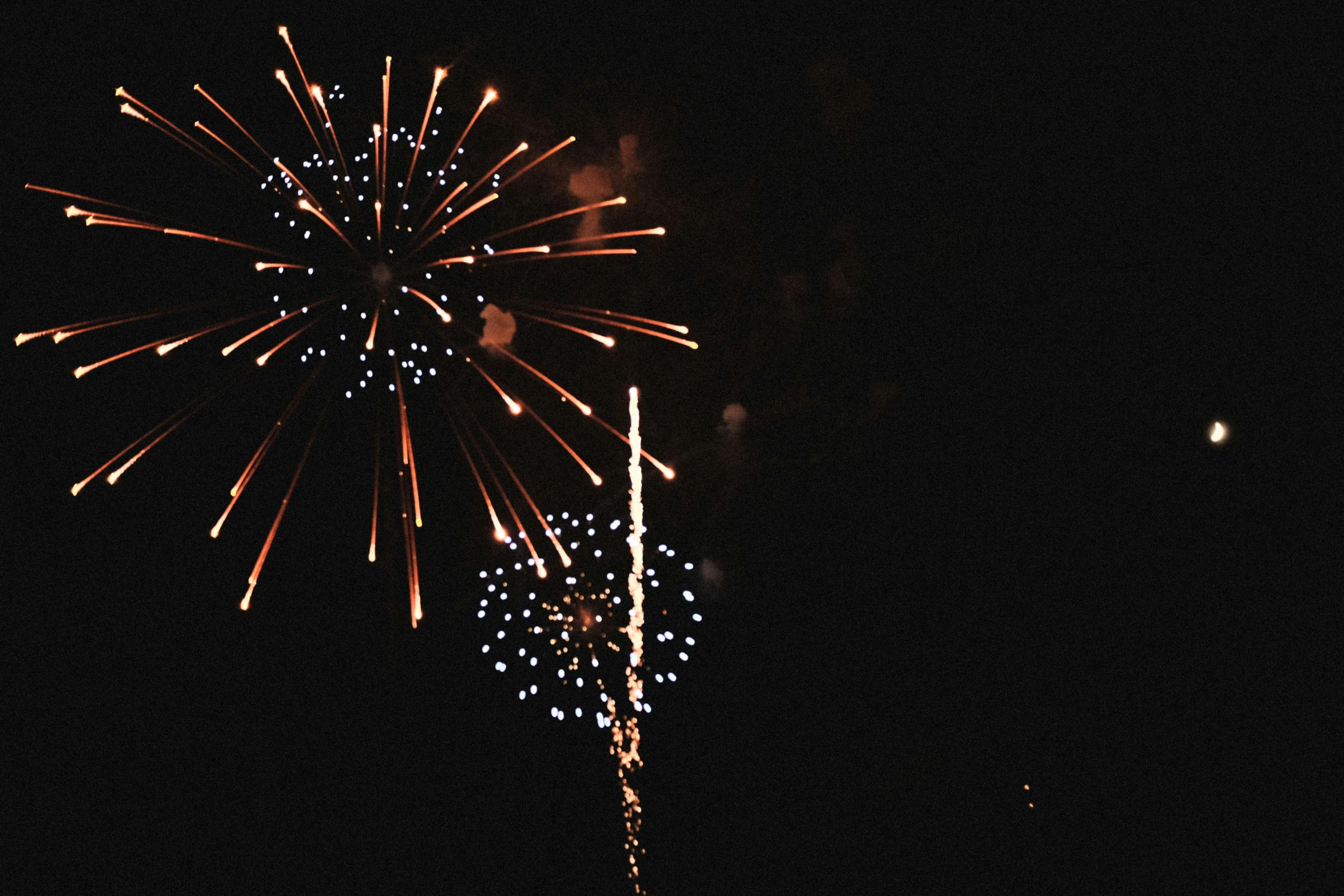 the fireworks are in the dark and lit up with colors