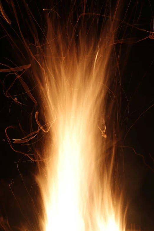 a close up of fire flames on a black background