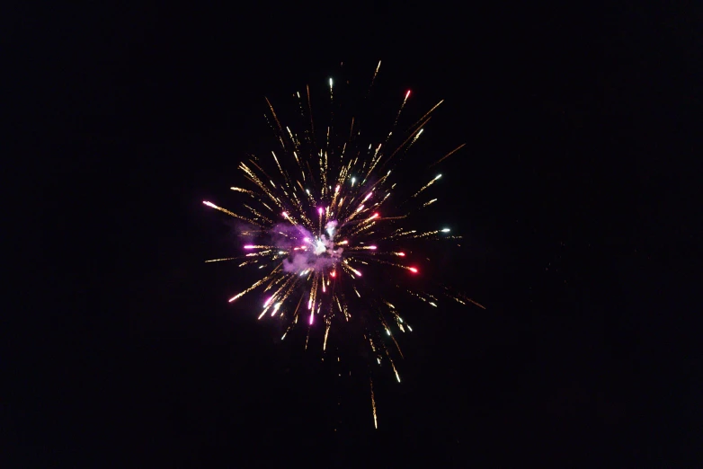 a very colorful fireworks display being carried out in the dark