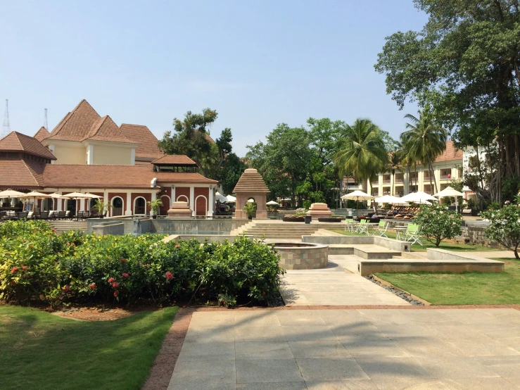 the courtyard of a building with trees and lawns