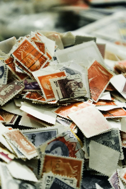 a pile of stamps are shown on top of each other