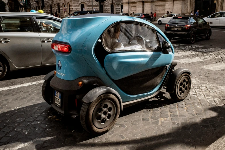 a motorized vehicle parked on a street next to a traffic light