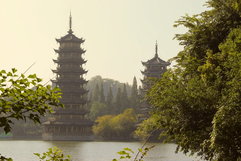 a tall tower stands out over a body of water