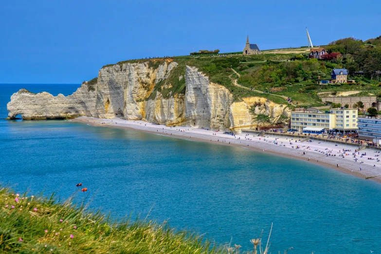 a big body of water by some cliffs