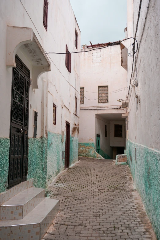 a narrow street with some buildings on each side