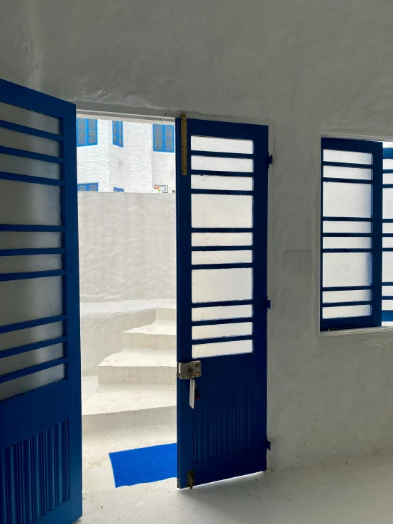 a room with windows that have bars on them