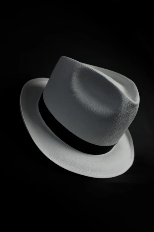 a white hat is shown against a black background
