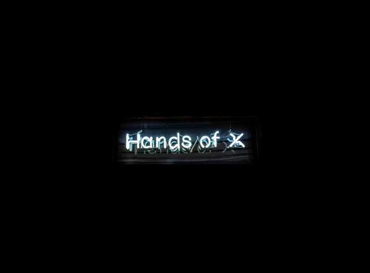 the words hands of x are lit up in the dark