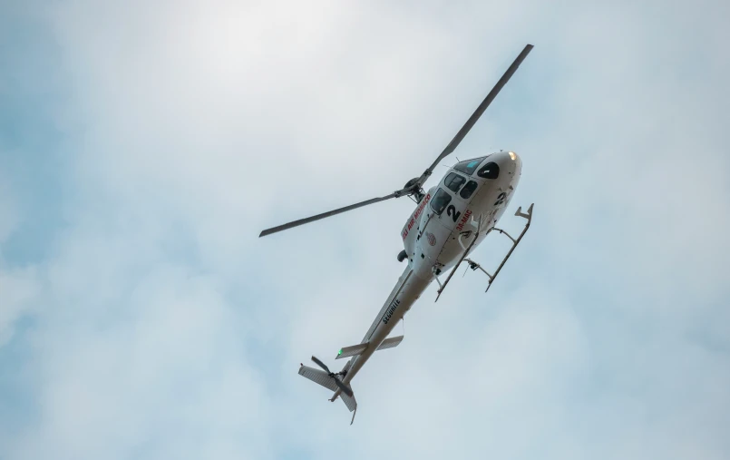 an airplane flying up in the sky with no landing gear