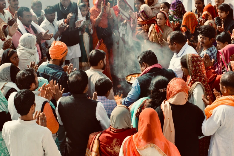 a group of people are gathered around a man