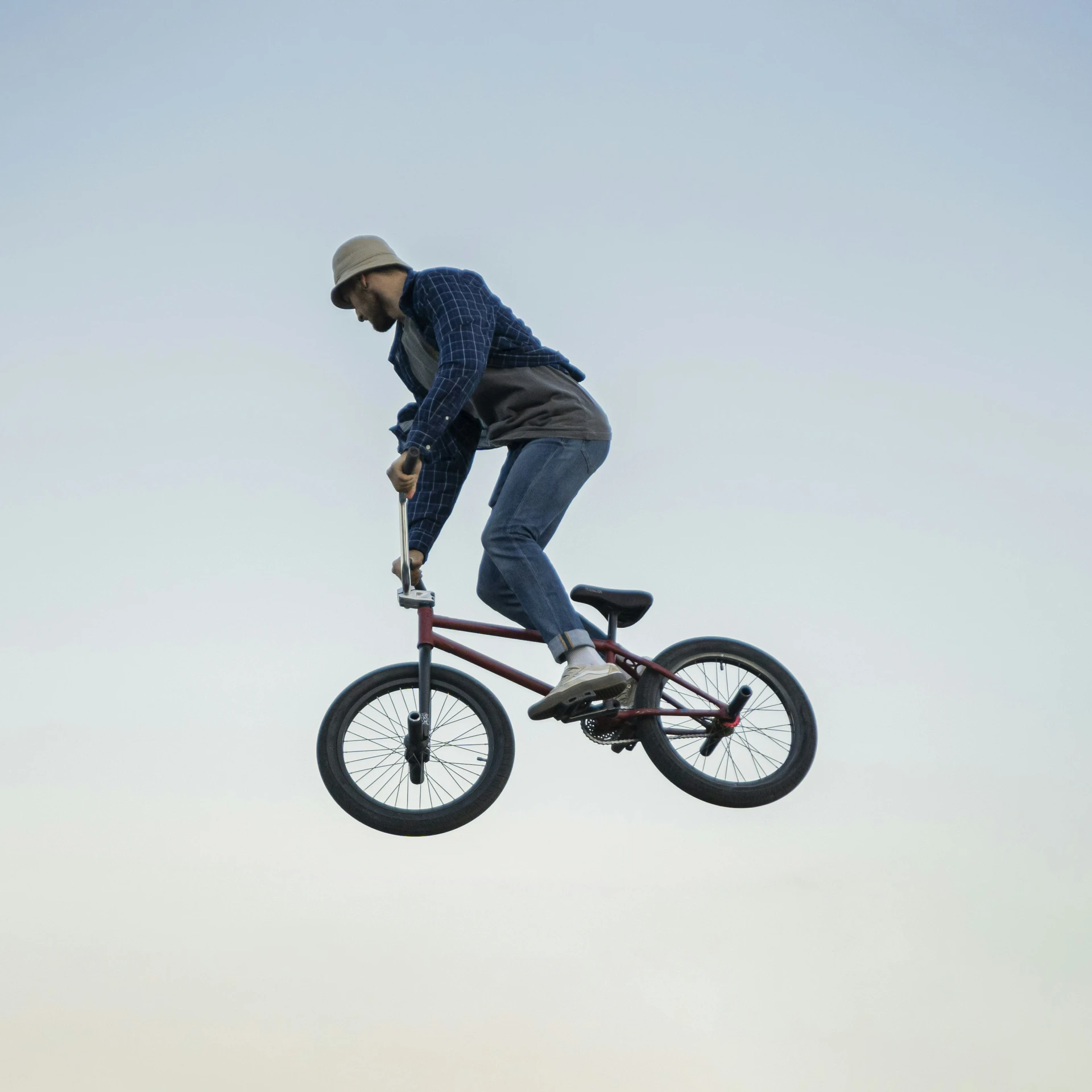 a person riding a bike high in the air